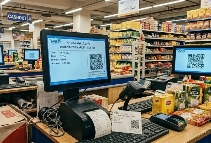 FBR digital invoicing system displayed on checkout monitors at Imtiaz Super Market Clifton with QR code receipts and POS setup
